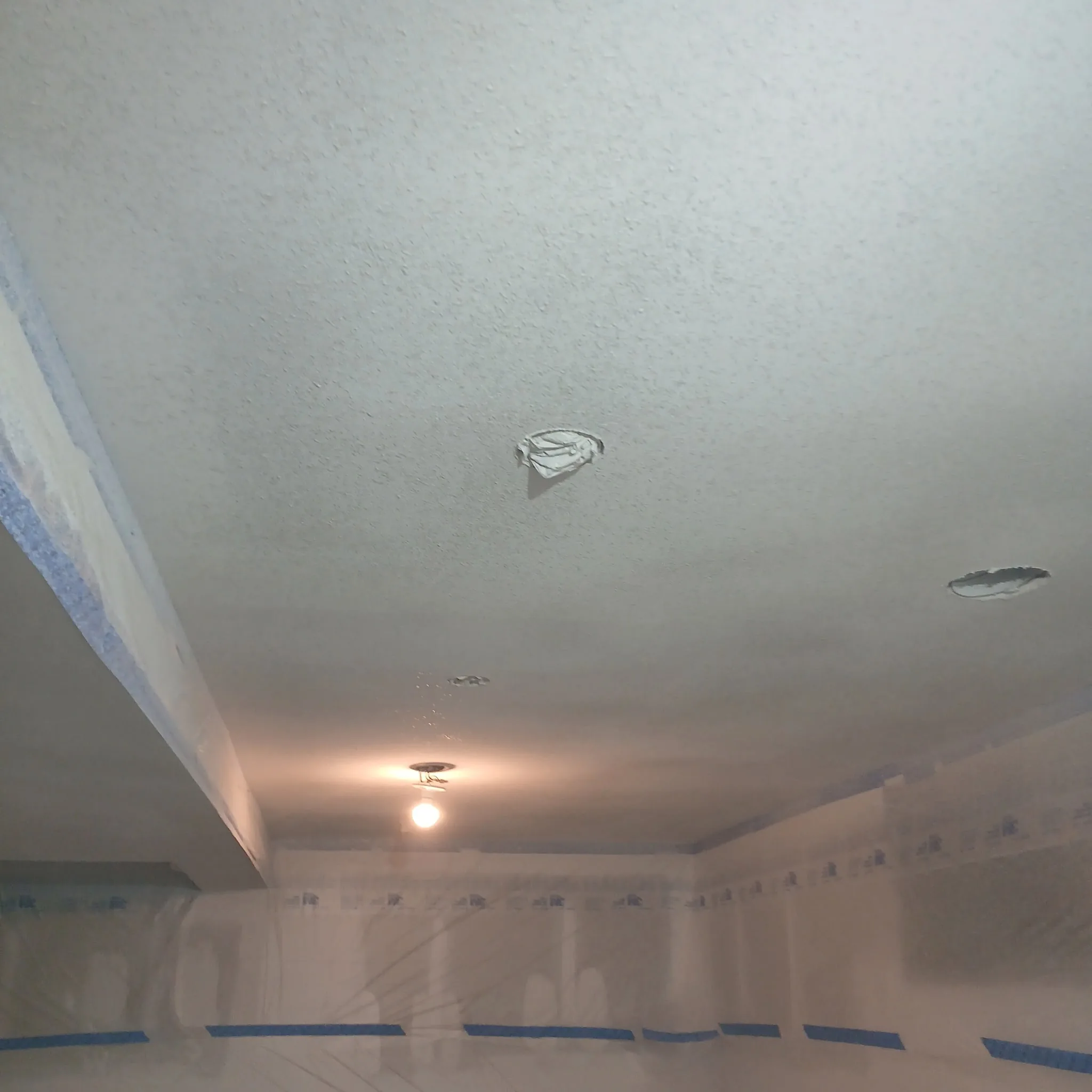 Basement framing and drywall installation in progress